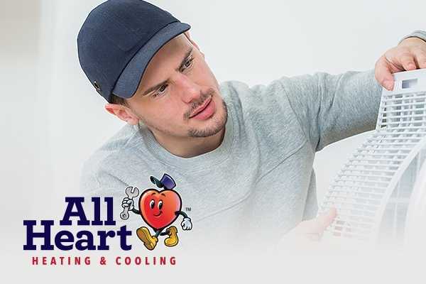 All Heart Cooling professional with hat and mascot image