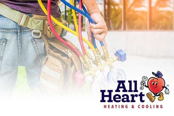 AC Maintenance Service Llano technician carries tool products and all heart mascot image