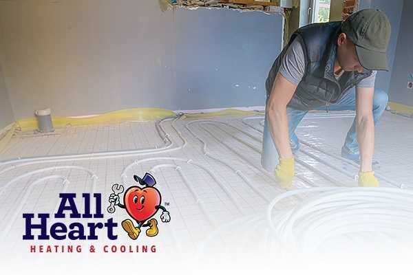 Expert works on Heating Installation Service Cal City banner with all heart mascot image