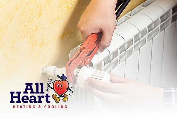 expert works on Heating Repair Service Cal City with all heart mascot image