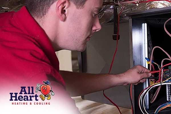 Technician works on Heating Maintenance Service Palmdale